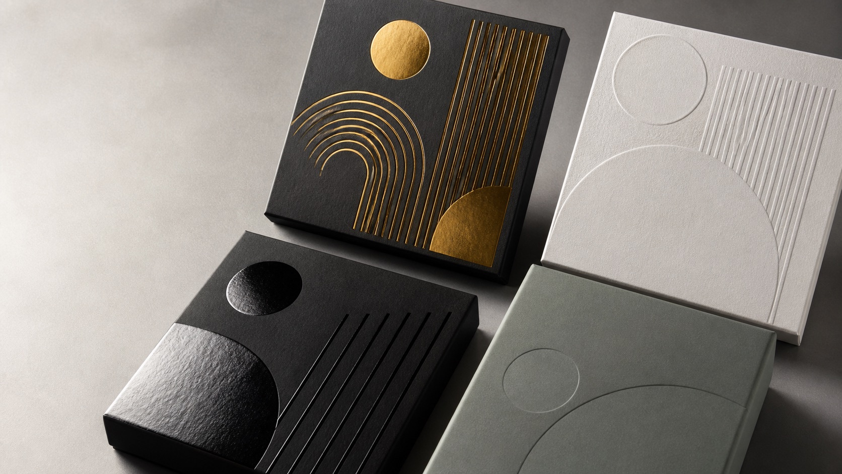 Custom packaging finishes showing gold foil, blind embossing, spot UV and matte lamination